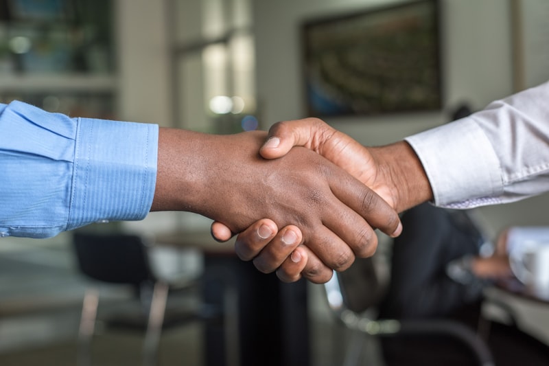 Business handshake sealing an incorporation agreement